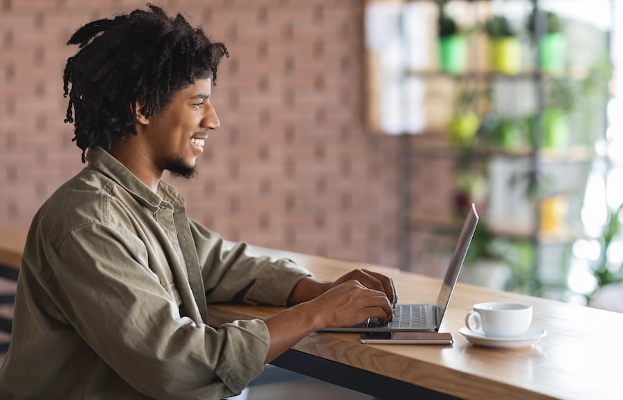 Remote Working Young Guy With Laptop